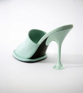 Mint green high-heeled shoe on a white background   | Sergio Rossi