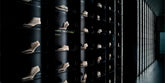 Display wall with rows of shoe lasts signed and arranged on glass shelves - 01   | Sergio Rossi