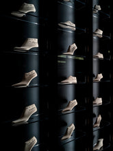 Display wall with rows of shoe lasts signed and arranged on glass shelves - 02   | Sergio Rossi