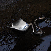 Metallic spoon on a dark, textured surface   | Sergio Rossi