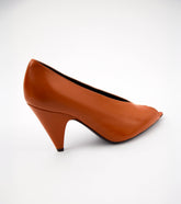 Brown high-heeled shoe on a white background   | Sergio Rossi